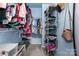 Organized walk-in closet featuring shelving and hanging space for clothes and accessories at 3915 Planters Watch Dr, Charlotte, NC 28278