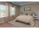 Serene main bedroom with large windows and neutral decor at 407 Bent Burr Crk, York, SC 29745
