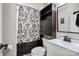 Well-maintained bathroom featuring a vanity, toilet, and a shower with stylish, patterned curtain at 4516 Kiser Island Rd # 1, Terrell, NC 28682