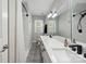 Modern bathroom featuring double sinks, a large mirror, and a stand-up shower with white tiling at 4516 Kiser Island Rd # 1, Terrell, NC 28682