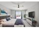 Primary bedroom with a king bed, sliding glass door, and a ceiling fan at 4516 Kiser Island Rd # 1, Terrell, NC 28682