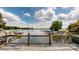 View of waterfront dock and lake from a wooden deck with railing at 4516 Kiser Island Rd # 1, Terrell, NC 28682