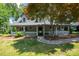 Charming home featuring a welcoming front porch and mature landscaping at 4516 Kiser Island Rd # 1, Terrell, NC 28682