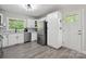 Updated kitchen features stainless appliances, white cabinets, and modern gray flooring, with ample natural light at 4516 Kiser Island Rd # 1, Terrell, NC 28682