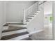 Clean staircase with gray wood treads and white risers and banister at 4516 Kiser Island Rd # 1, Terrell, NC 28682