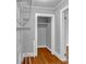 Walk-in closet with custom shelving and hardwood floors, offering ample storage space at 5785 Nc 150 E Hwy, Denver, NC 28037