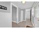 Hallway with a doorway, bathroom, and storage options including a closet at 5785 Nc 150 E Hwy, Denver, NC 28037