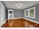 Bright living room featuring hardwood floors and natural light from the window at 5785 Nc 150 E Hwy, Denver, NC 28037
