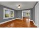 Living room boasts hardwood floors, neutral paint, and seamlessly connects to the adjacent room at 5785 Nc 150 E Hwy, Denver, NC 28037