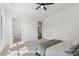 Bright bedroom with a ceiling fan, carpet, and two entryways at 5820 Pittmon Ln, Kannapolis, NC 28081