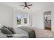 Bright bedroom featuring a ceiling fan and an attached bathroom at 5820 Pittmon Ln, Kannapolis, NC 28081