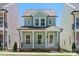 Charming two-story home with a welcoming front porch and beautiful curb appeal at 5820 Pittmon Ln, Kannapolis, NC 28081