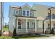 Charming two-story home with a welcoming front porch and beautiful curb appeal at 5820 Pittmon Ln, Kannapolis, NC 28081