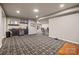 Finished basement with a lounge area, decorative bar, recessed lighting, and unique carpet at 6008 Candlestick Ln, Lancaster, SC 29720