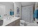 The bathroom includes a single sink vanity with a shower-tub combo and decorative shower curtain at 6008 Candlestick Ln, Lancaster, SC 29720