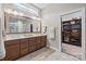 Modern bathroom featuring a double vanity with wood cabinets and a glass-enclosed shower at 6008 Candlestick Ln, Lancaster, SC 29720