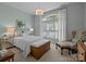 Serene bedroom with a large window, plush bedding, and elegant decor with carpet floors at 6008 Candlestick Ln, Lancaster, SC 29720