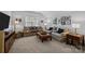 Comfortable sitting area includes two sofas, tables, decorative lamps, and decoratively framed wall art at 6008 Candlestick Ln, Lancaster, SC 29720