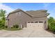 View of the home's rear exterior showcasing the garage and siding at 6008 Candlestick Ln, Lancaster, SC 29720
