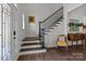 Welcoming foyer with hardwood floors, a staircase, and elegant decor for a stylish entrance at 6008 Candlestick Ln, Lancaster, SC 29720