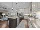 Spacious kitchen featuring a large island with seating, stainless appliances and modern finishes at 6008 Candlestick Ln, Lancaster, SC 29720
