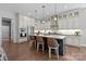 Modern kitchen with a large island, stainless steel appliances, and stylish pendant lighting at 6008 Candlestick Ln, Lancaster, SC 29720
