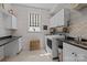 Bright laundry room features white shiplap walls, front load washer/dryer, and ample counter space for folding at 6008 Candlestick Ln, Lancaster, SC 29720