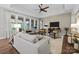 Bright living room with large windows, hardwood floors, neutral tones, and stylish furnishings at 6008 Candlestick Ln, Lancaster, SC 29720