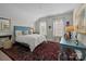 Carpeted bedroom features large windows, an area rug, a bed with pillows and soft light at 6008 Candlestick Ln, Lancaster, SC 29720