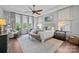Bright main bedroom with a tray ceiling, large windows, and elegant furnishings for a relaxing retreat at 6008 Candlestick Ln, Lancaster, SC 29720