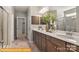 Bright bathroom featuring double vanity, elegant mirrors, a glass shower, and stylish fixtures at 6443 Honor Ave, Midland, NC 28107