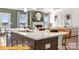 Modern kitchen island with quartz countertops and stainless steel appliances at 6443 Honor Ave, Midland, NC 28107