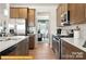 Spacious kitchen featuring stainless steel appliances, wooden cabinets, and ample counter space at 6443 Honor Ave, Midland, NC 28107