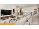 Spacious living room featuring plush seating and a modern entertainment center at 6443 Honor Ave, Midland, NC 28107