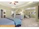 Spacious main bedroom featuring a cozy sitting area and elegant furnishings at 6443 Honor Ave, Midland, NC 28107