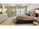 Serene main bedroom with a king bed, decorative pillows, and a view of the outside at 6443 Honor Ave, Midland, NC 28107
