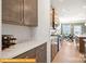 Spacious pantry with wooden cabinets, countertop space, and built-in storage for kitchen essentials at 6443 Honor Ave, Midland, NC 28107