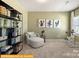 Bright sitting room with a comfortable chair and a view of the neighborhood at 6443 Honor Ave, Midland, NC 28107