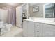 Bathroom featuring a double vanity, shower and toilet at 7040 Edenderry Dr, Charlotte, NC 28270