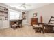 Sun-lit bedroom with built-in shelving unit and ceiling fan at 7040 Edenderry Dr, Charlotte, NC 28270