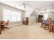 Spacious carpeted bedroom, featuring a ceiling fan and natural light at 7040 Edenderry Dr, Charlotte, NC 28270