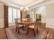 Formal dining room featuring hardwood floors and a chandelier at 7040 Edenderry Dr, Charlotte, NC 28270