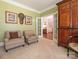 Inviting living room with neutral decor, paired armchairs, and charming wall art at 7040 Edenderry Dr, Charlotte, NC 28270