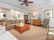 Inviting living room featuring neutral decor, a ceiling fan, and an open floor plan at 7040 Edenderry Dr, Charlotte, NC 28270