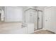Bright bathroom featuring a separate shower and tub with natural light from shuttered windows at 7040 Edenderry Dr, Charlotte, NC 28270