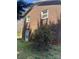 Brick home exterior with a door access and healthy green bushes at 739 Owls Den Rd, Lincolnton, NC 28092