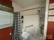Bathroom featuring a tiled shower with a shower chair at 739 Owls Den Rd, Lincolnton, NC 28092