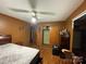 Bedroom featuring orange walls, hardwood floors, and a bed with a mattress at 739 Owls Den Rd, Lincolnton, NC 28092