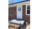 Charming front door with a decorative wreath and a step up entrance at 739 Owls Den Rd, Lincolnton, NC 28092