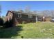 Well-maintained brick home featuring a clean front lawn and white trimmed windows at 739 Owls Den Rd, Lincolnton, NC 28092